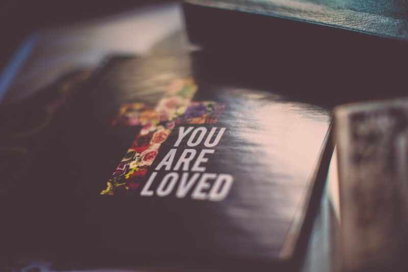 selective focus photography of You Are Loved book photo