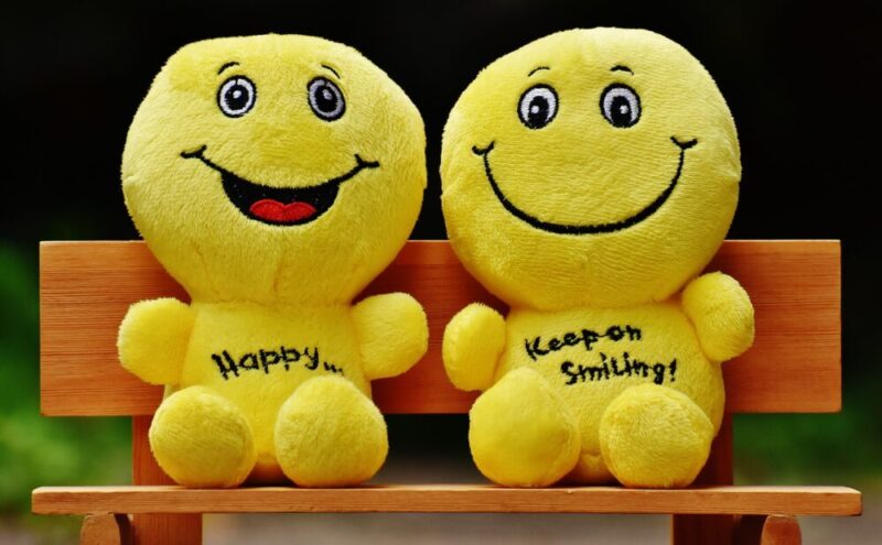 two smiling dolls