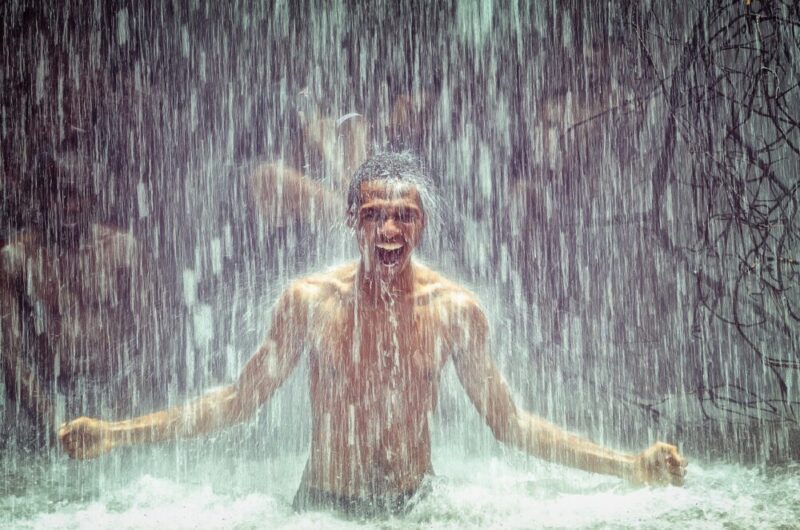 man waterfalls bathe
