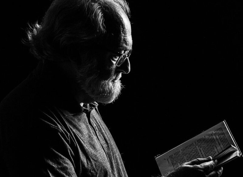 man reading education portrait beard