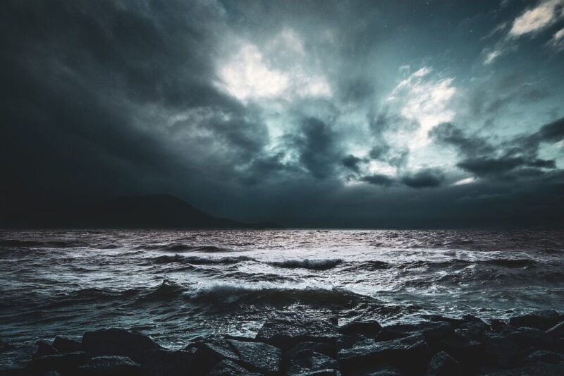 quiet sea surrounded by darkness