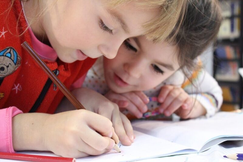 two children studying